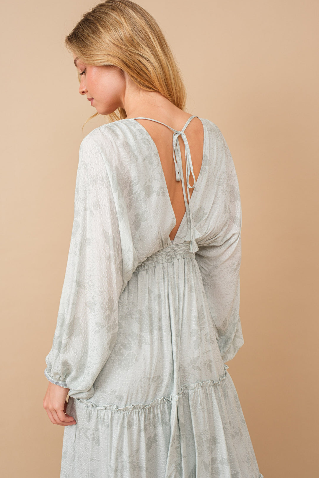 Jacquard Floral Dolman Maxi Dress with V-neck, tiered ruffle details, and tie tassel back, made from luxurious rayon fabric.